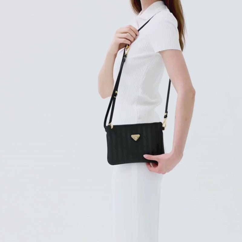 TAMINS | Umhängetasche classic schwarz/gold VIDEO